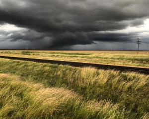 Oklahoma storms over a grassy field